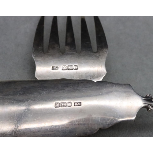 374 - A pair of Sheffield silver fish servers with raised scroll handles, maker's mark HW, 7.1oz