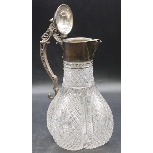 377 - A heavy cut glass round bulbous claret jug with Sheffield silver neck, hinged lid and scroll handle,... 