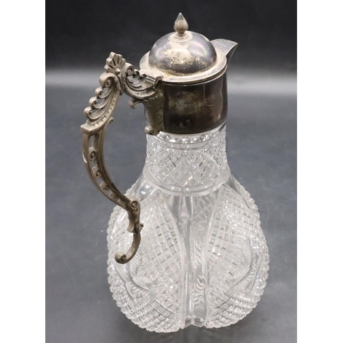 377 - A heavy cut glass round bulbous claret jug with Sheffield silver neck, hinged lid and scroll handle,... 