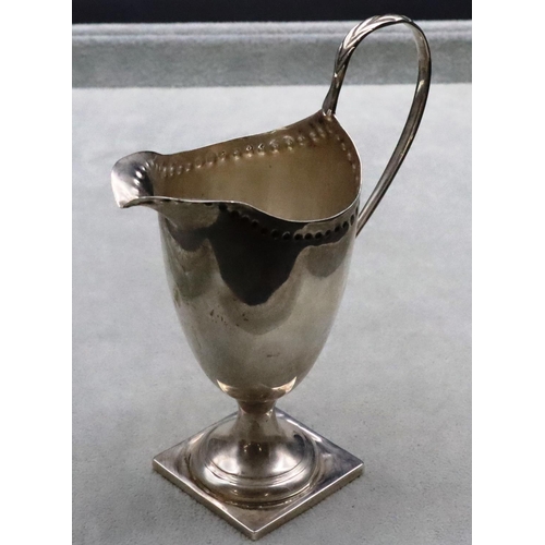 378 - A Victorian silver cream jug with scroll handle on square base, Birmingham 1893, 14.5cm high, 3.3oz