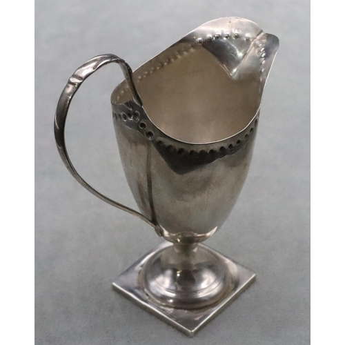 378 - A Victorian silver cream jug with scroll handle on square base, Birmingham 1893, 14.5cm high, 3.3oz