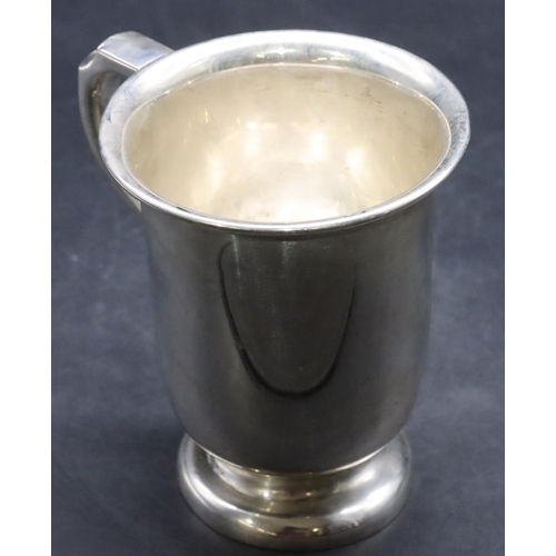 382 - A Birmingham plain silver trumpet shaped tankard with scroll handle on sweeping foot, 13cm high, 8.3... 