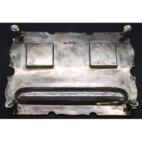 384 - An Edward VII silver rectangular scallop shaped ink stand on splayed hoof feet with a pair of square... 