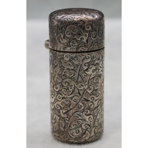 391 - A Victorian silver Sampson Mordan cylindrical scent bottle with allover chased decoration and hinged... 