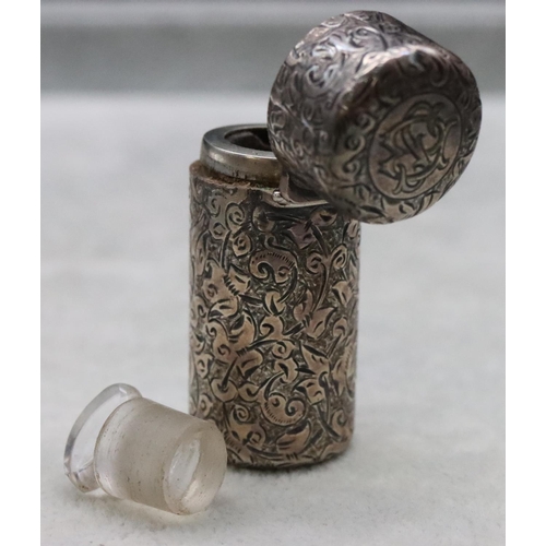 391 - A Victorian silver Sampson Mordan cylindrical scent bottle with allover chased decoration and hinged... 