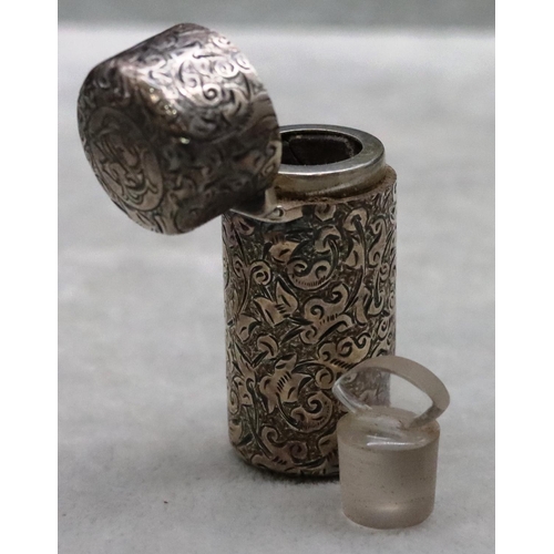 391 - A Victorian silver Sampson Mordan cylindrical scent bottle with allover chased decoration and hinged... 