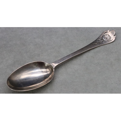 394 - An Edward VII Arts & Crafts presentation rat tail spoon with hammered handle depicting floral motif,... 