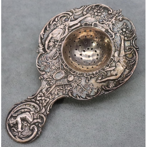 397 - Berthold Muller imported Chester silver tea strainer with allover raised figure, floral and scroll d... 