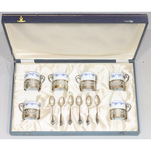 408 - A set of 6 Continental porcelain coffee cans in silver coloured metal frames with 6 matching spoons,... 