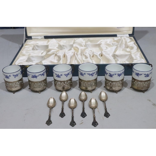 408 - A set of 6 Continental porcelain coffee cans in silver coloured metal frames with 6 matching spoons,... 