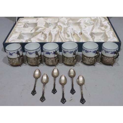 408 - A set of 6 Continental porcelain coffee cans in silver coloured metal frames with 6 matching spoons,... 