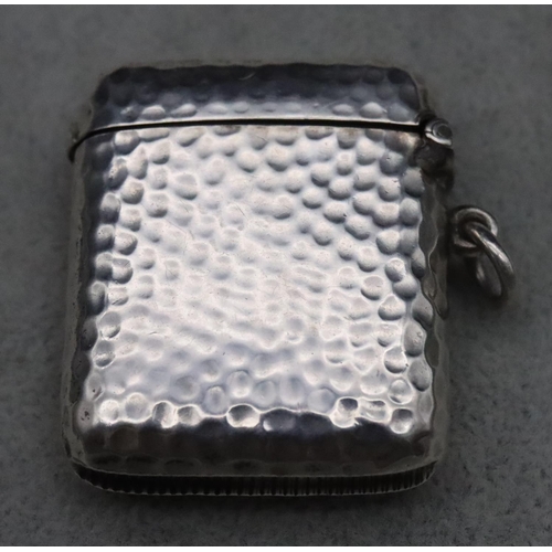 410 - A Victorian hammered silver vesta case with hinged lid, maker William Neale, 0.8oz