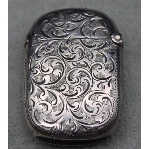 411 - A late Victorian silver vesta case with allover chased decoration and hinged lid, Chester 1895, 0.6o... 