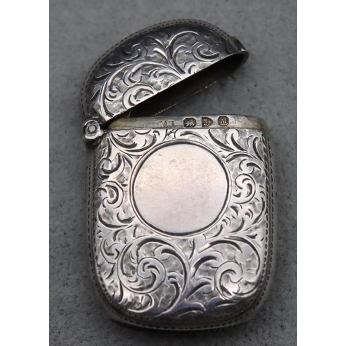 411 - A late Victorian silver vesta case with allover chased decoration and hinged lid, Chester 1895, 0.6o... 