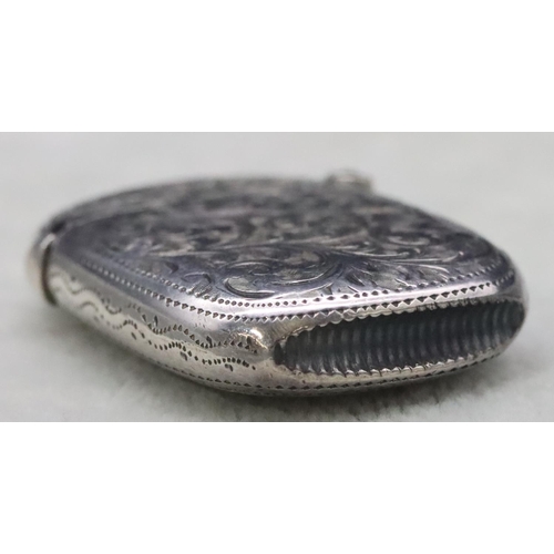 411 - A late Victorian silver vesta case with allover chased decoration and hinged lid, Chester 1895, 0.6o... 