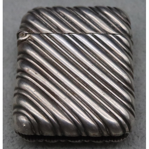 413 - A Victorian silver vesta case with ribbed fluted decoration and hinged lid, maker John Aldwinckler &... 