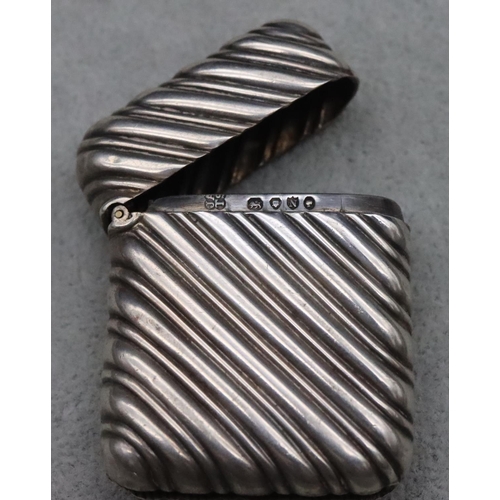 413 - A Victorian silver vesta case with ribbed fluted decoration and hinged lid, maker John Aldwinckler &... 