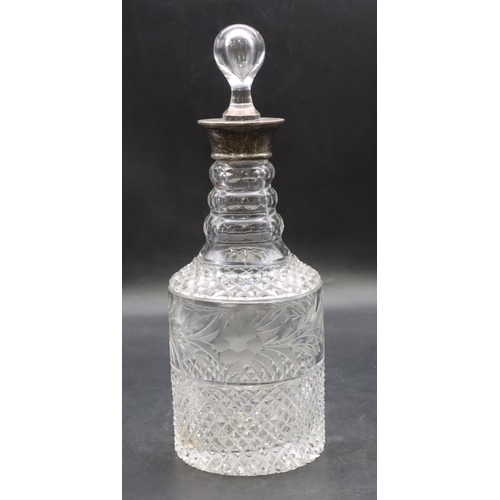 416 - A heavy cut glass and etched round bulbous thin necked decanter with Birmingham silver neck (odd sto... 