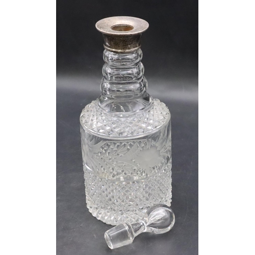 416 - A heavy cut glass and etched round bulbous thin necked decanter with Birmingham silver neck (odd sto... 