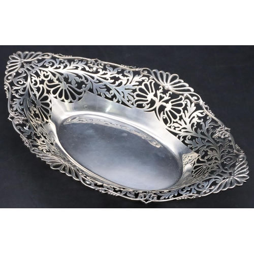 431 - A London silver basket with pierced scallop shaped gallery with allover floral, leaf and scroll deco... 