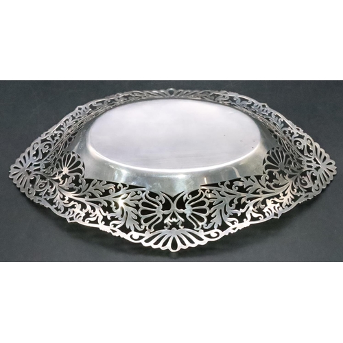 431 - A London silver basket with pierced scallop shaped gallery with allover floral, leaf and scroll deco... 