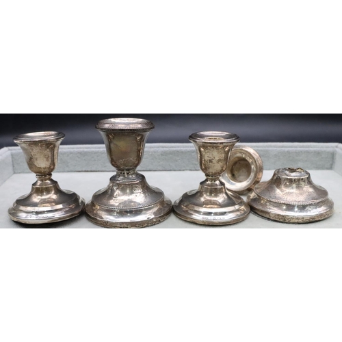 454 - A pair of Birmingham silver dwarf candlesticks on round sweeping bases (1 base dented), 6cm high and... 