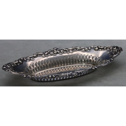 457 - A Birmingham silver oval boat shaped dish with pierced and embossed floral, leaf and scroll rim, 17.... 