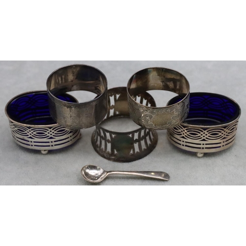 459 - A pair of Birmingham oval silver salts with blue glass liners and ball feet and 3 odd silver napkin ... 