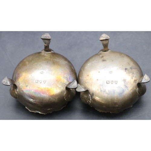 468 - A pair of Victorian silver round bulbous shaped salts with scallop shaped rims on 3 hoof feet, 3.9oz... 