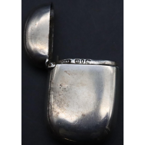 469 - A Birmingham plain silver vesta case with engraved monogram and hinged lid