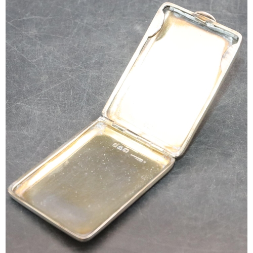 470 - A Chester silver matchbox case holder with allover engine turned decoration and hinged front, 1.1oz