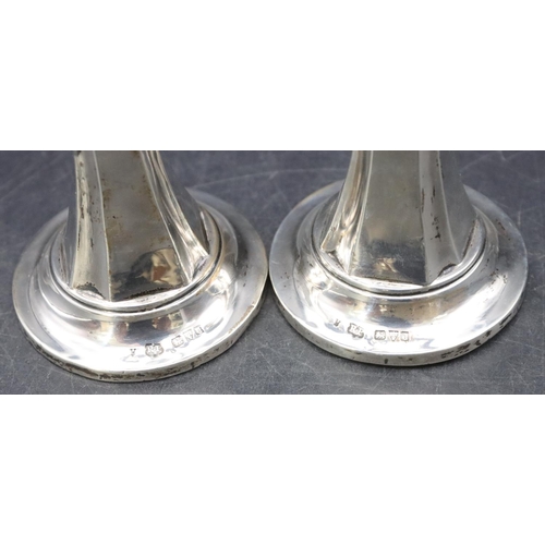 471 - A pair of Chester silver trumpet shaped spill vases with crinkle rims and allover chamfer decoration... 