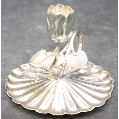 472 - A Victorian Birmingham silver round scallop shaped chamber candlestick with branch and petal decorat... 