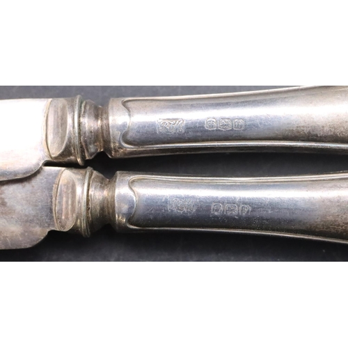 488 - A pair of Sheffield silver sugar tongs with claw ends and a set of 6 Sheffield silver handled butter... 