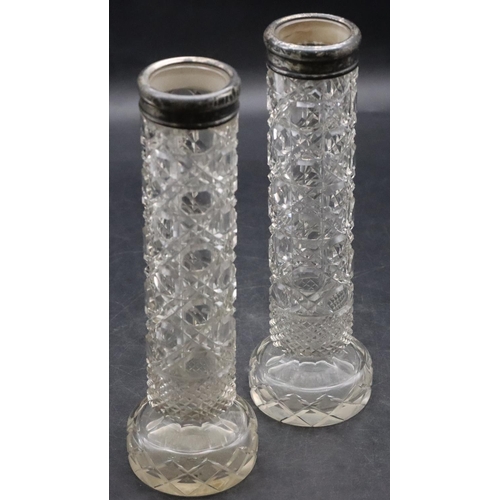 489 - A pair of cut glass cylindrical spill vases with Birmingham silver rims, 20cm high