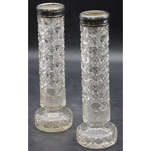 489 - A pair of cut glass cylindrical spill vases with Birmingham silver rims, 20cm high