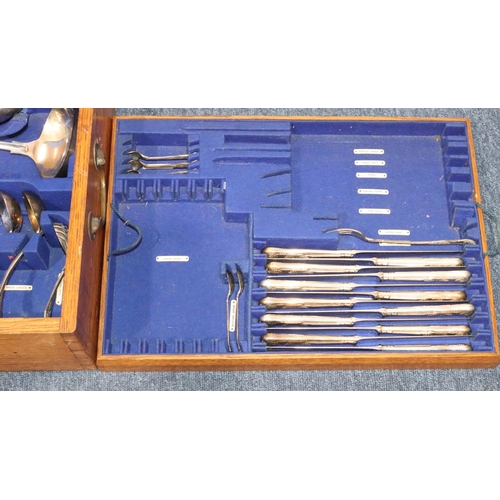 492 - A silver plated King's pattern 12-place setting flatware service and an oak canteen case with furthe... 