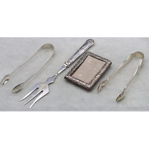 494 - A pair of Georgian plain silver sugar tongs, another pair of Sheffield silver sugar tongs, 2.2oz, a ... 