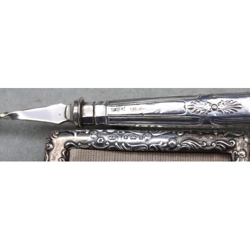 494 - A pair of Georgian plain silver sugar tongs, another pair of Sheffield silver sugar tongs, 2.2oz, a ... 