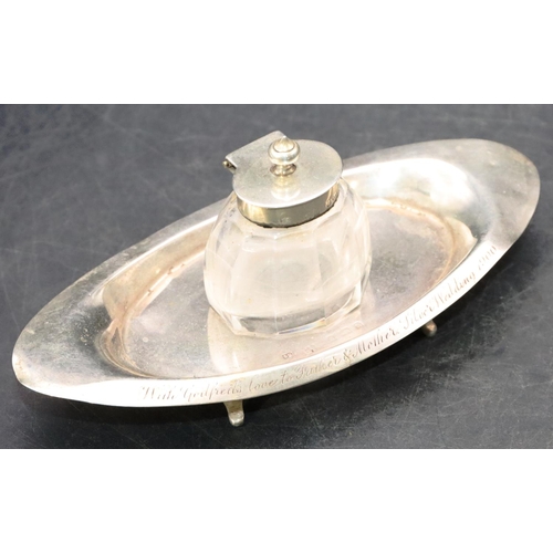 497 - A Birmingham silver oval boat shaped ink stand set with centre cut glass inkwell with silver hinged ... 