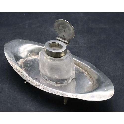 497 - A Birmingham silver oval boat shaped ink stand set with centre cut glass inkwell with silver hinged ... 