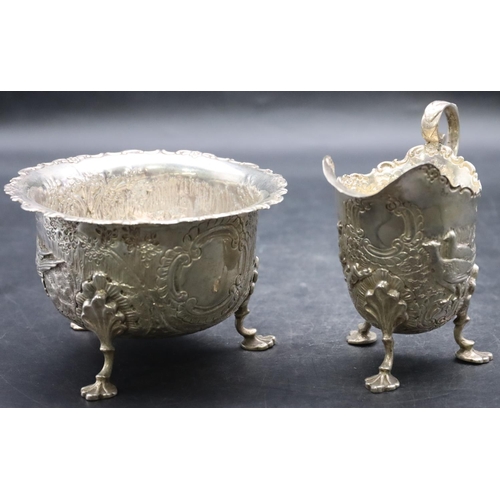 500 - A late Victorian silver milk jug and sugar bowl with crinkled rim and allover embossed rabbits and p... 