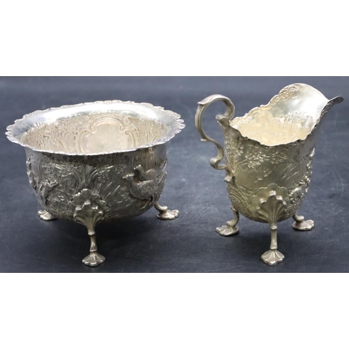 500 - A late Victorian silver milk jug and sugar bowl with crinkled rim and allover embossed rabbits and p... 