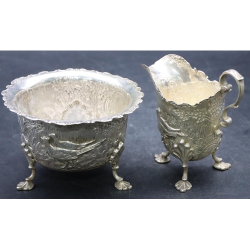 500 - A late Victorian silver milk jug and sugar bowl with crinkled rim and allover embossed rabbits and p... 