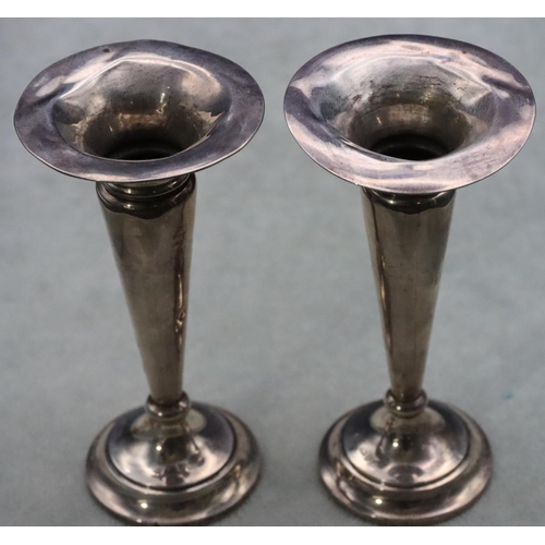 503 - A pair of Chester silver round trumpet shaped spill vases on round weighted bases, 13cm high (rims d... 