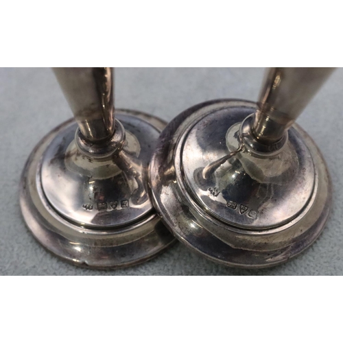 503 - A pair of Chester silver round trumpet shaped spill vases on round weighted bases, 13cm high (rims d... 