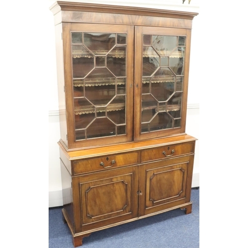 939 - A George III mahogany bookcase with 2 astragal glass doors enclosing leather fronted adjustable shel... 