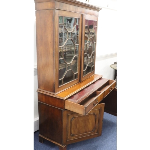 939 - A George III mahogany bookcase with 2 astragal glass doors enclosing leather fronted adjustable shel... 