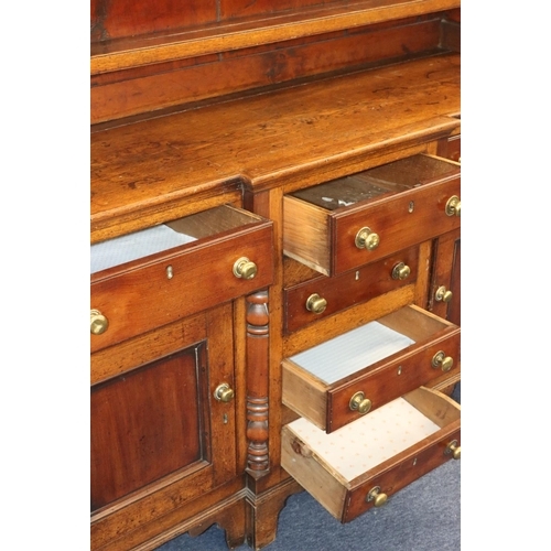 954 - A George III oak and mahogany breakfront Welsh dresser with shelfed back, 4 graduated centre drawers... 