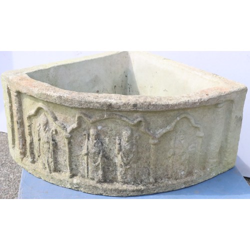 881 - A garden corner half round jardinière with raised figure decoration, 66cm wide, 50.5cm deep and 26cm... 